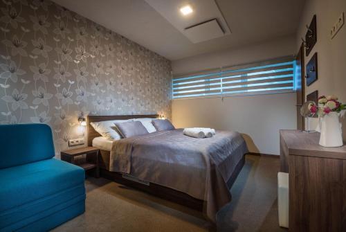Postel nebo postele na pokoji v ubytování Apartmánový Dom Kriváň
