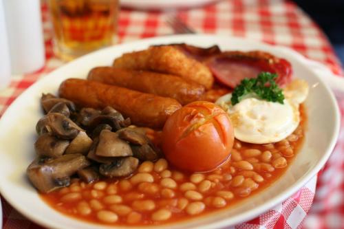 a plate of food with beans and meat and eggs at Dairy Guest House in York