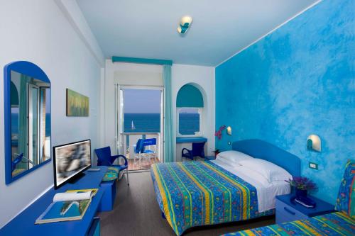 Кровать или кровати в номере Hotel Napoleon