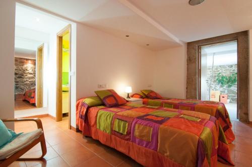 Un pat sau paturi într-o cameră la Outeiro de Setecamiños