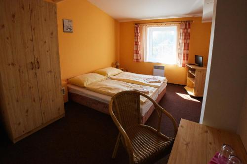 Llit o llits en una habitació de Resort Ohrada