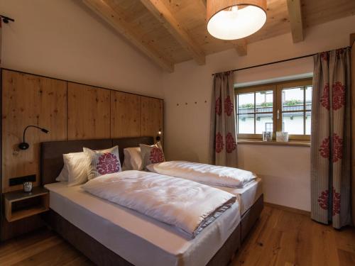 Ein Bett oder Betten in einem Zimmer der Unterkunft Rossberg Hohe Tauern Chalets -8
