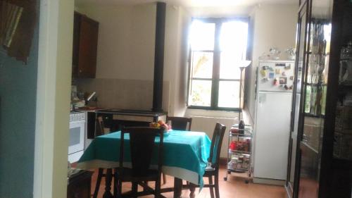 a kitchen with a table with a blue table cloth at Baduerughe - ValledelLago in Poggio Mirteto