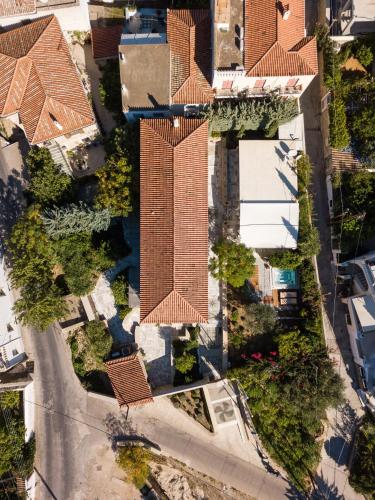 an overhead view of a building with a roof at Mare Monte Luxury Suites in Spetses