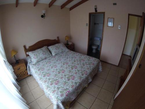 Ein Bett oder Betten in einem Zimmer der Unterkunft Apart Hotel Escala Real