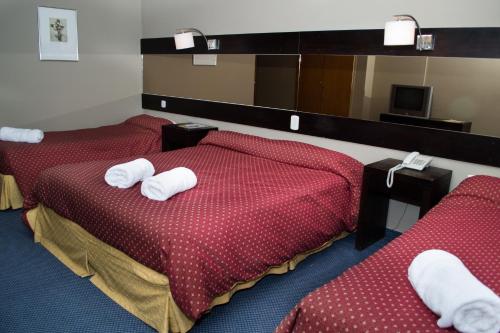 Ένα ή περισσότερα κρεβάτια σε δωμάτιο στο Marcopolo Suites Calafate