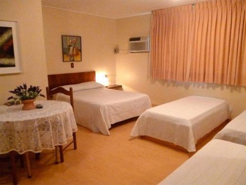 Un pat sau paturi într-o cameră la Hotel Primavera