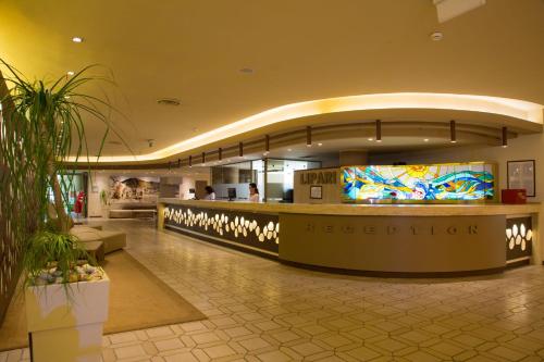 a lobby of a hotel with a reception counter at MClub Lipari in Sciacca