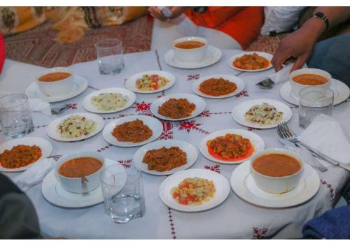 a table full of plates of food on a table at Riad Gzira Fez in Fez