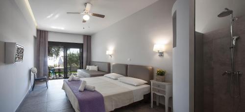 a hotel room with a bed and a bathroom at Locanda Barbati Luxury ApartHotel in Barbati