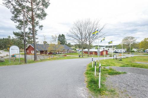 a street with flags on the side of a road at KustCamp Ekön in Gryt