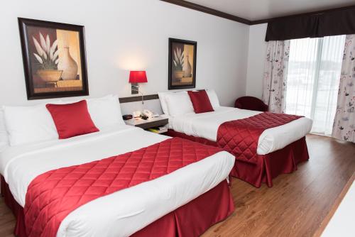 Ένα ή περισσότερα κρεβάτια σε δωμάτιο στο Hôtel Le Floral
