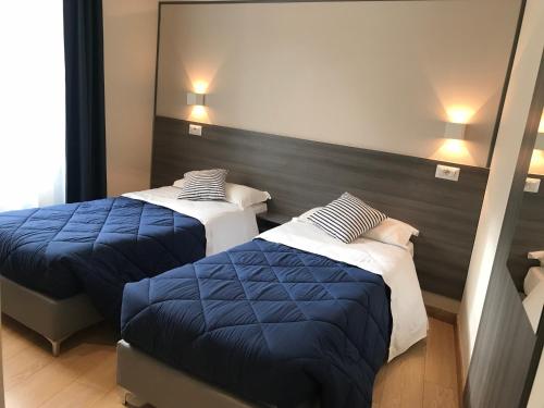 Postel nebo postele na pokoji v ubytování Boutique Hôtel Neptune Nice