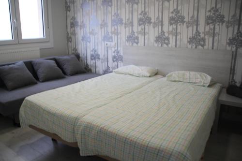 Ένα ή περισσότερα κρεβάτια σε δωμάτιο στο Apartamentos Logroño Centro