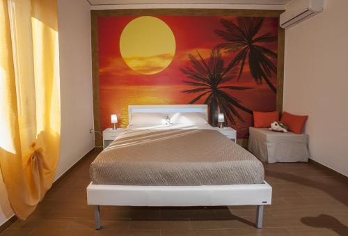a bedroom with a bed with a painting on the wall at Enjoy Vida in Casola di Napoli