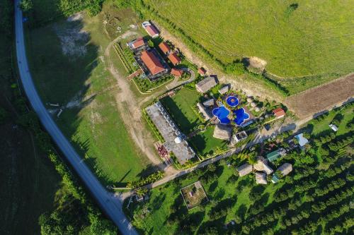 an aerial view of a farm with a tractor at Hacienda San Vicente in Flores