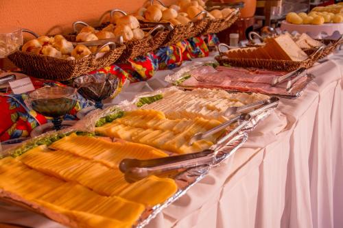 a buffet with many different types of food on a table at Hotel Terra do Sol in Aracaju