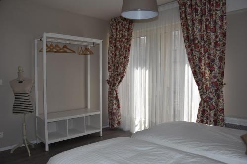 Ένα ή περισσότερα κρεβάτια σε δωμάτιο στο Grand Appartement Vue Cathédrale