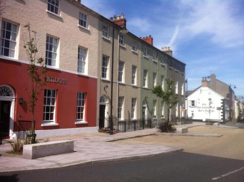 a row of buildings on a city street at Cara-Na-Mara in Killough