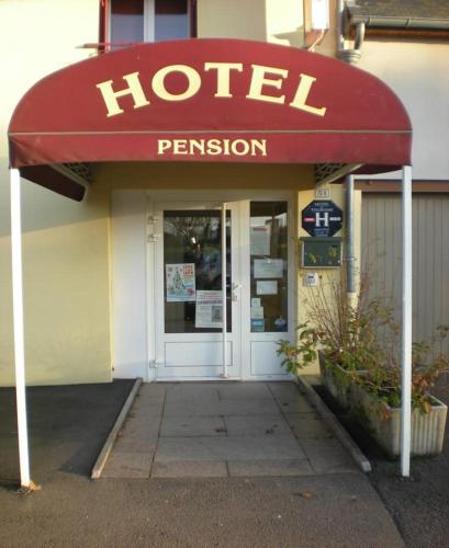 a hotel sign on the front of a building at Aux Quatre Vents in Saulieu