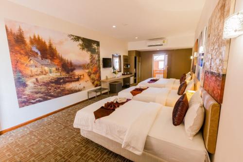 Postel nebo postele na pokoji v ubytování Roseate Chiang Mai