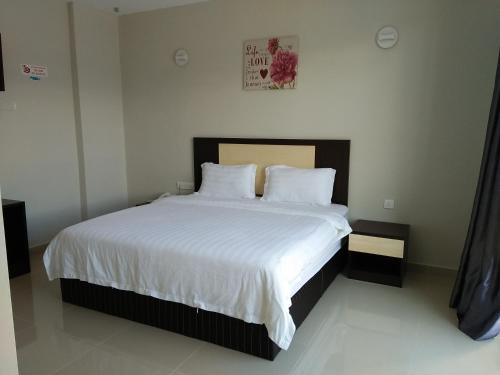 Ένα ή περισσότερα κρεβάτια σε δωμάτιο στο The One Boutique Hotel