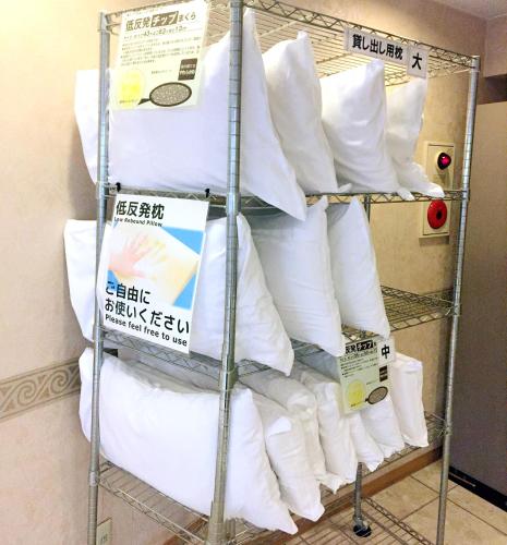 a rack full of toilet paper in a room at Hotel Koga Hills (Former: Koga Ark Hotel) in Koga