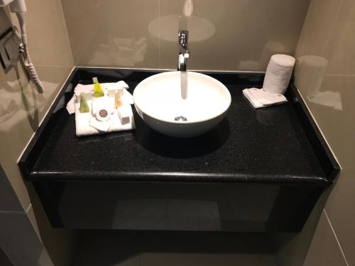 a bathroom counter with a sink in a bathroom at Best Western Plus Metepec & Suites in Toluca