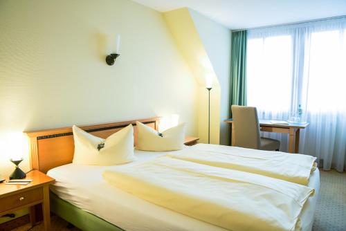 Ringhotel Dreiländereck Zittauにあるベッド