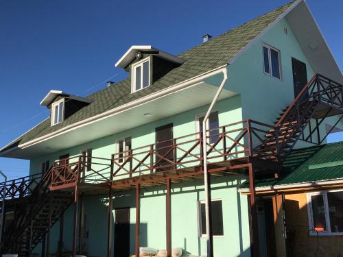 a house with a roof that is being constructed at Alakol-Jyrgalan Guest House in Dzhergalan