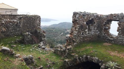 an old stone building on top of a hill at Castle Hotel in Himare