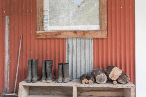 a group of boots and rocks on a bench at The Pear Orchard Lodge in Richmond
