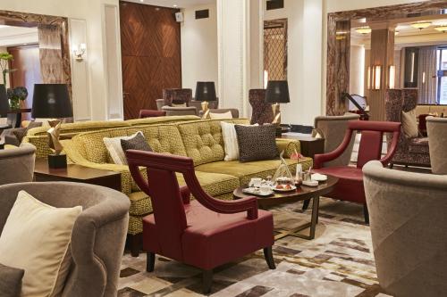 Télévision ou salle de divertissement dans l'établissement Grand Hotel Kempinski Riga