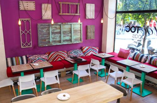 a living room filled with furniture and decor at Toc Hostel Sevilla in Seville
