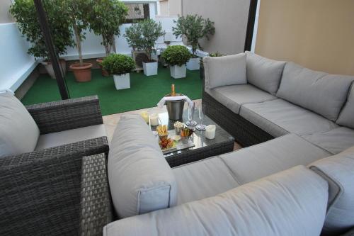 a living room with a couch and a table at Casablanca Suites & Spa in Casablanca