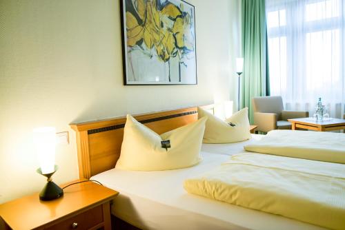 Ringhotel Dreiländereck Zittauにあるベッド