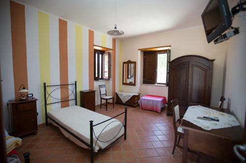 Tempat tidur dalam kamar di La Casa Del Priore