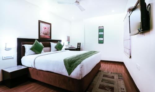 a bedroom with a bed and a television in it at Hotel Fairway in Amritsar