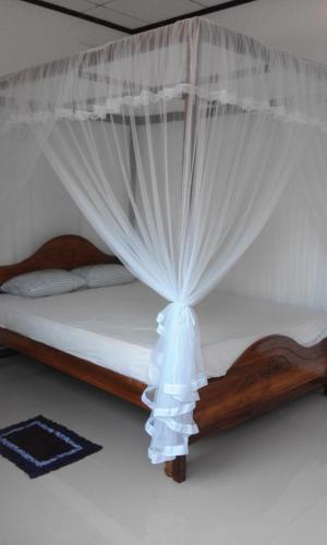 Llit o llits en una habitació de Coco One Holiday Inn