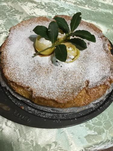 a cake with powdered sugar on top of it at Sa Perda Lada in Fluminimaggiore