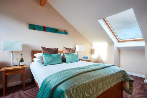 A bed or beds in a room at The Whitbarrow Hotel at Whitbarrow Village