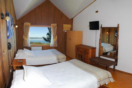 Postel nebo postele na pokoji v ubytování Hotel Faros del Sur