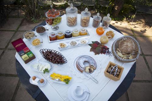 a white table with food on top of it at Agriturismo Bannata in Piazza Armerina