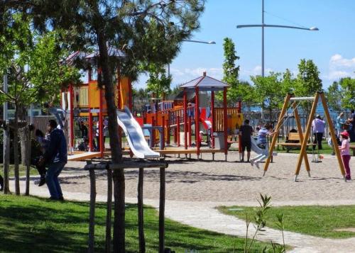 a park with children playing in a playground at Alpha Omega (AΩ) Vintage Suite in Thessaloniki