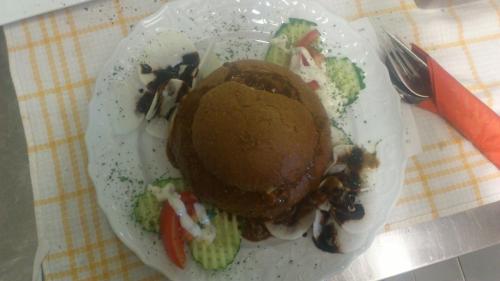 a plate with an ice cream and vegetables on it at Gaststätte und Pension Felsenthal in Tabarz