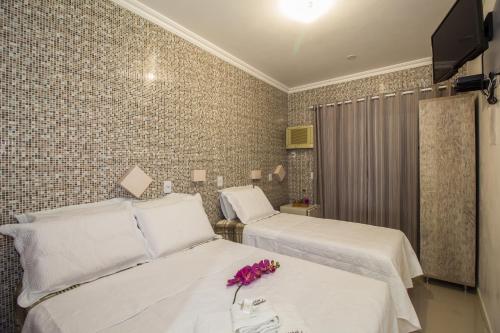 Ένα ή περισσότερα κρεβάτια σε δωμάτιο στο Hotel Engenho