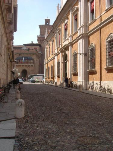 an empty street in a city with buildings at Hotel De Prati in Ferrara