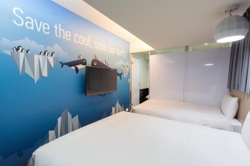 Katil atau katil-katil dalam bilik di Morwing Hotel - Culture Vogue