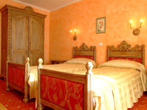 Postel nebo postele na pokoji v ubytování Hotel Royal
