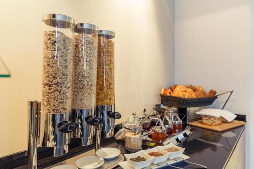 a buffet filled with food and bowls of food at Altstadthotel Kneitinger, Abensberg in Abensberg